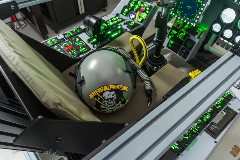 Flight helmet resting among illuminated cockpit controls