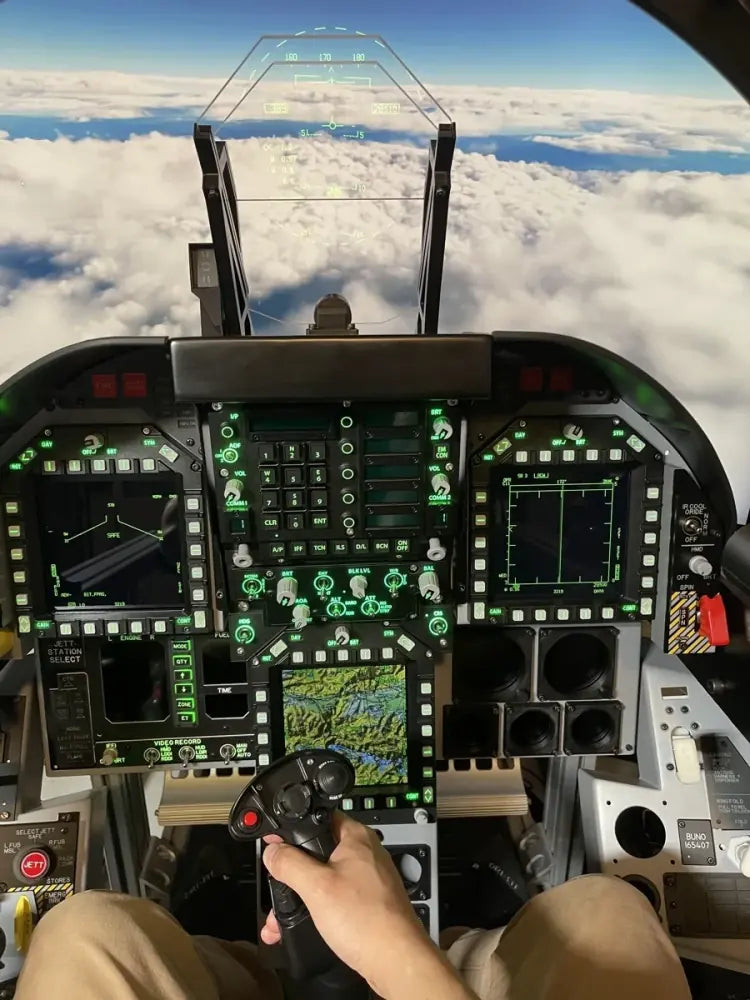 Pilot seated inside a fully illuminated Dogfight Dynamics cockpit