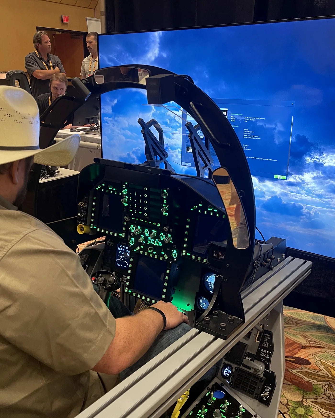 Visitor flying the Dogfight Dynamics cockpit at FlightSimExpo 2024