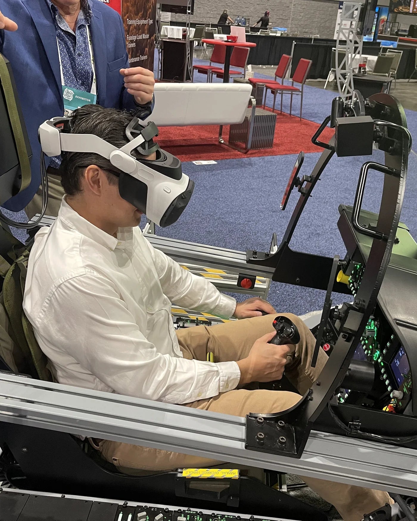 I/ITSEC attendee flying the Dogfight Dynamics cockpit in virtual reality
